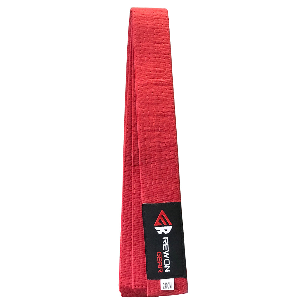 Red karate, taekwondo, and judo rank belt with reinforced seams for durability, ideal for martial arts training and competition.