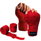 Red Rewon wrist wraps for boxing and fitness, providing hand support and protection. Ideal for training with boxing gloves and MMA gear.