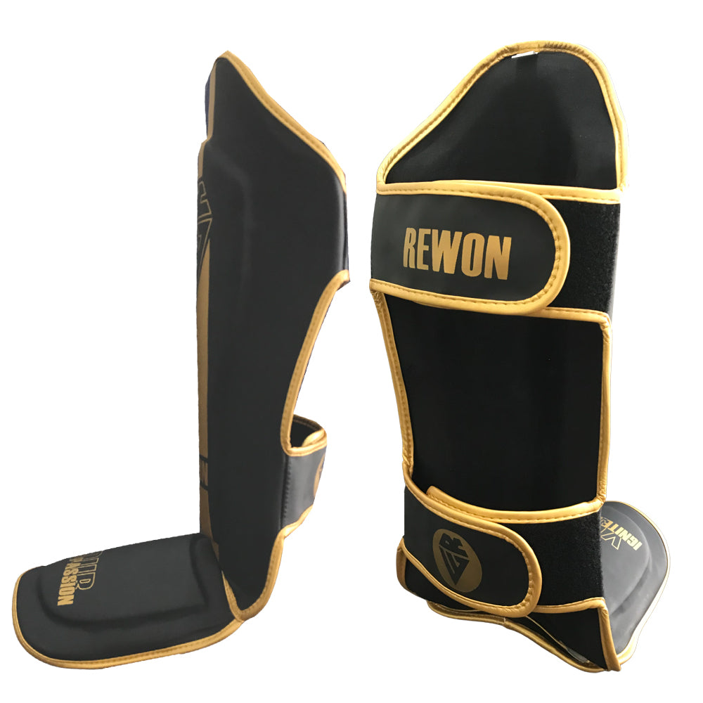 Rewon Classic Schienbeinschoner Schwarz/Gold für Kampfsport, ideal für Boxen und Kickboxen mit Kunstleder und Klettverschluss.