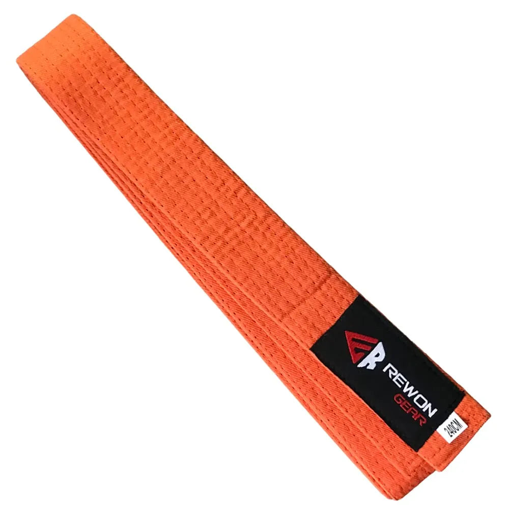 Orange karate belt with Rewon Gear label, ideal for martial arts, boxing, and fitness training. Durable with strong stitching.