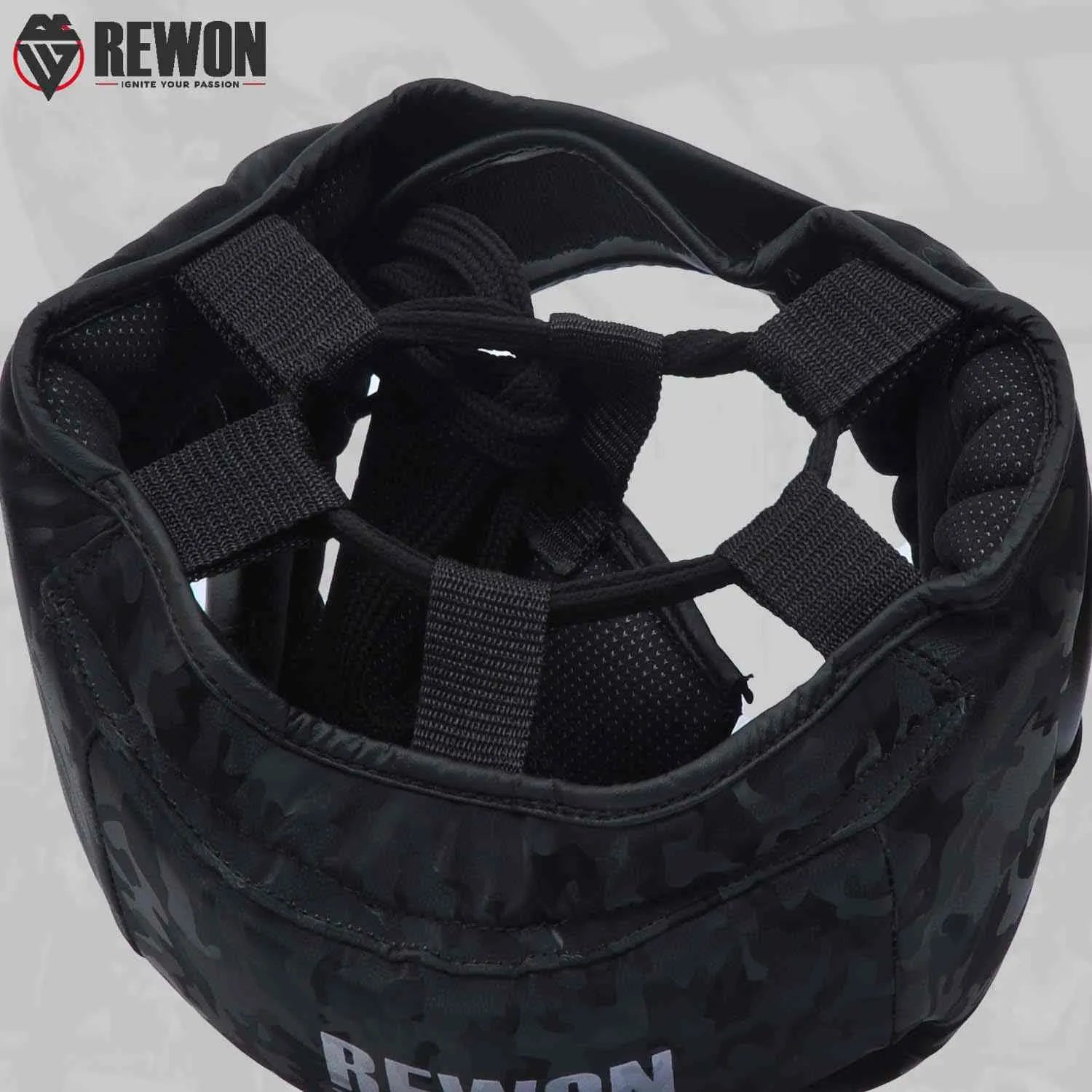 Camouflage Rewon boxing headgear with foam padding for MMA and kickboxing, ensures protection for all skill levels.
