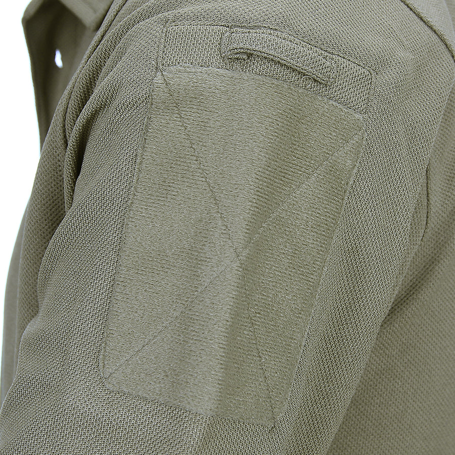 Close-up of a tactical polo shirt's sleeve with pen pocket and Velcro, made of quick-dry polyester fabric, ideal for fitness training.